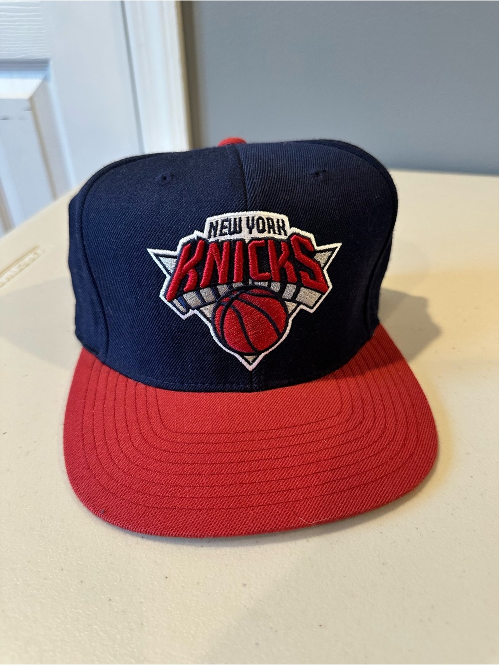 Mitchell & Ness NY Knicks Navy & Burgundy SnapBack Hat